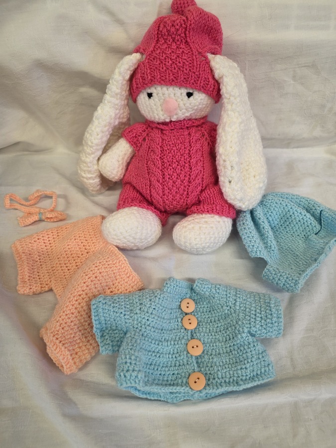 Rabbit and outfits for a grandchild by Jackie
